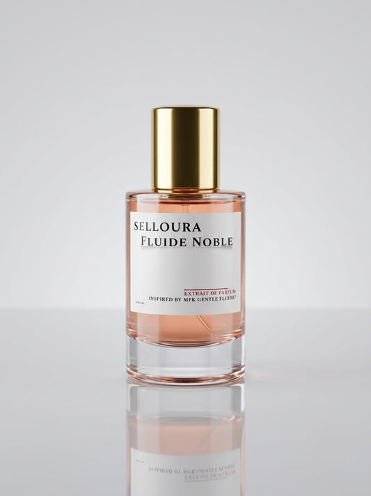 A bottle of Selloura Fluide Noble perfume with a gold cap and a white label, showing a light peach-pink liquid inside, set against a clean light gray background with a soft reflection below.